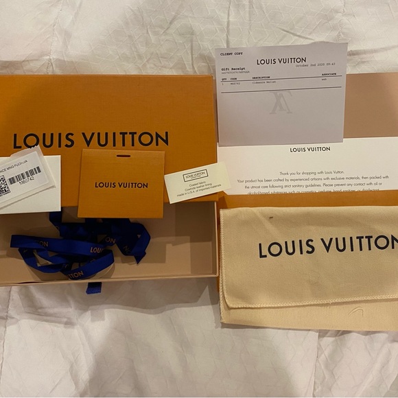 Louis Vuitton Clemence monogram wallet with fuschia interior. - Picture 8 of 8